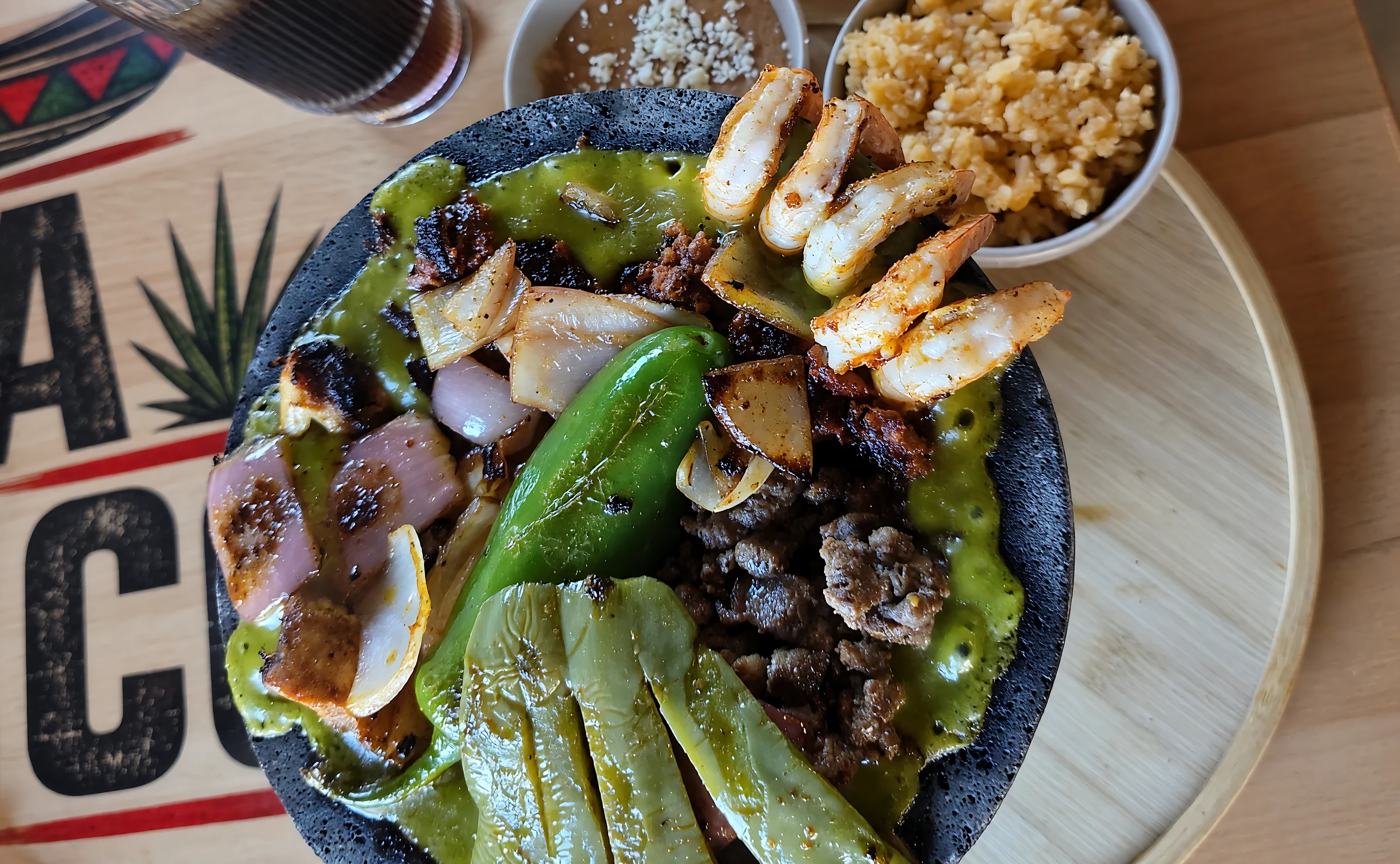 Molcajete Mixto with grilled steak, shrimp, nopales and salsa verde at MEXIKAN in Heritage Valley, Edmonton